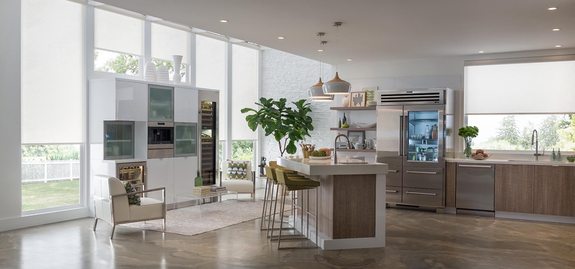 Kitchen with large windows halfway covered with white shades